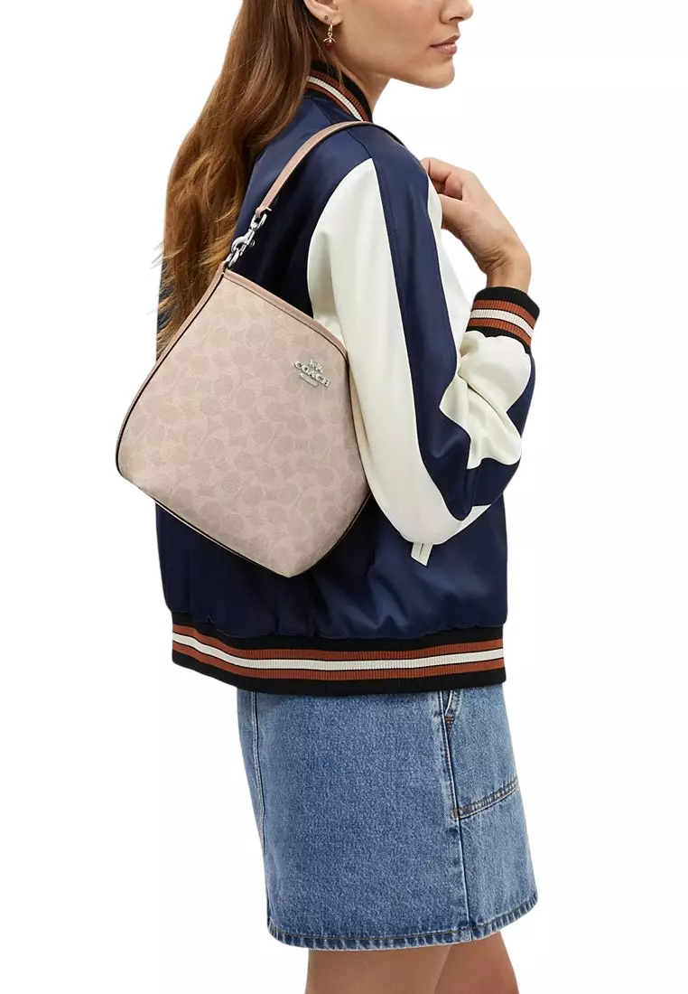 City Bucket Bag In Signature Canvas - Sand Beige