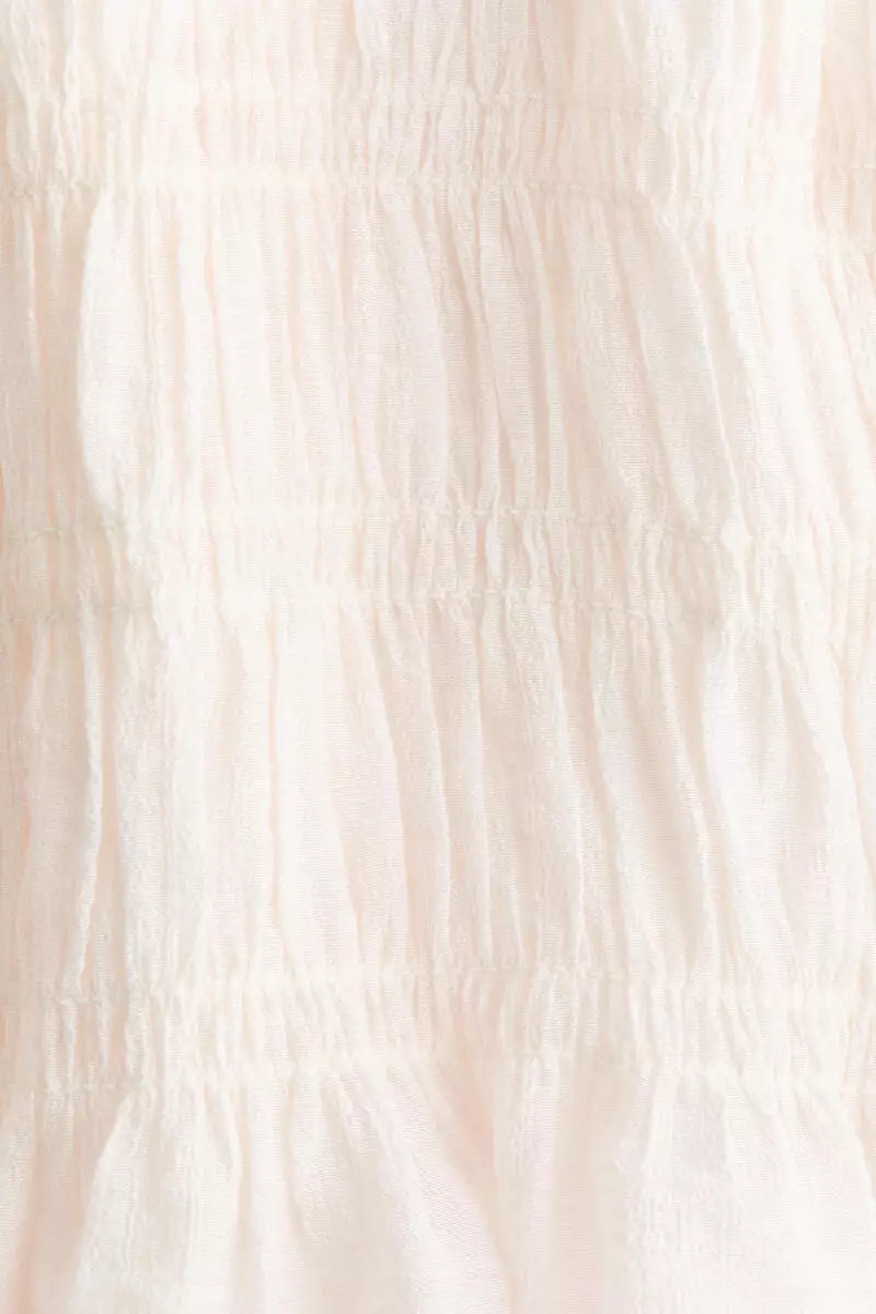 Smocked peplum top
