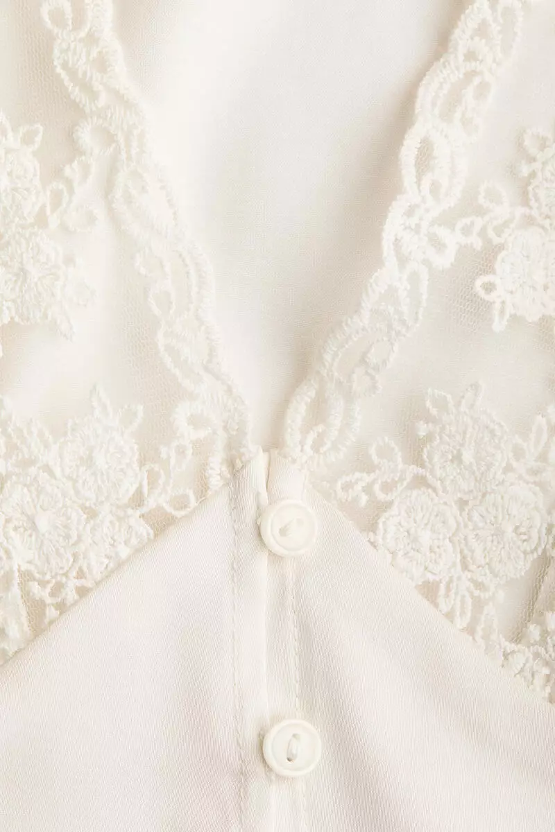 Cropped lace-trimmed top