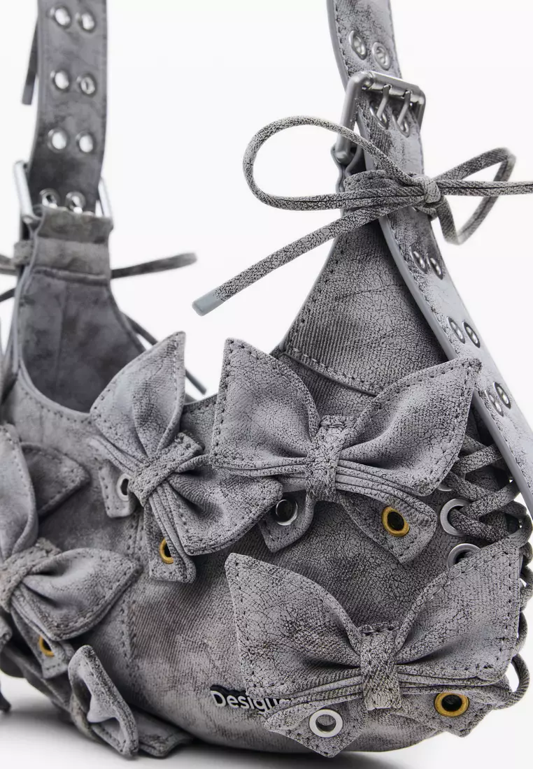 Handbag with small butterfly decoration