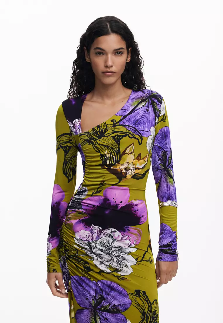 Asymmetric neckline dress designed by Mr. Christian Lacroix