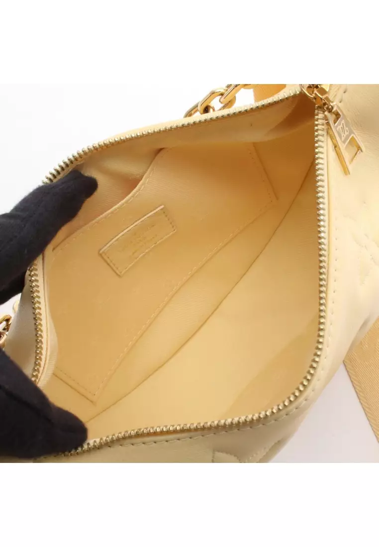 Pre-Loved Louis Vuitton over- The moon bubble glam banana chain handbag leather Light yellow