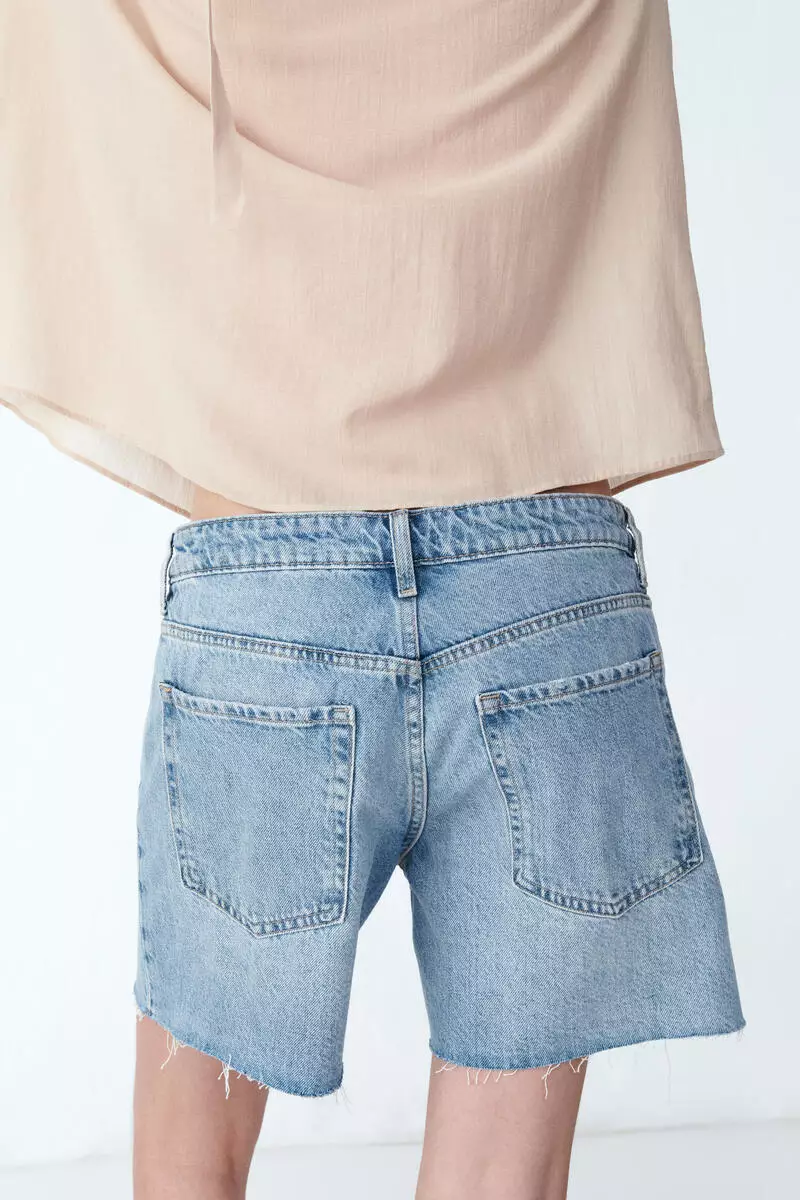 Raw-edge denim shorts