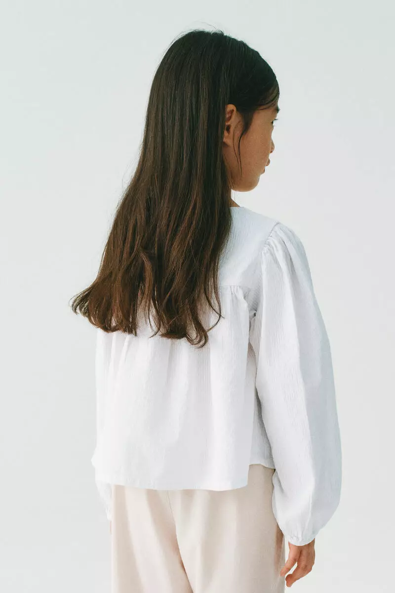 Bow-detail cotton seersucker blouse