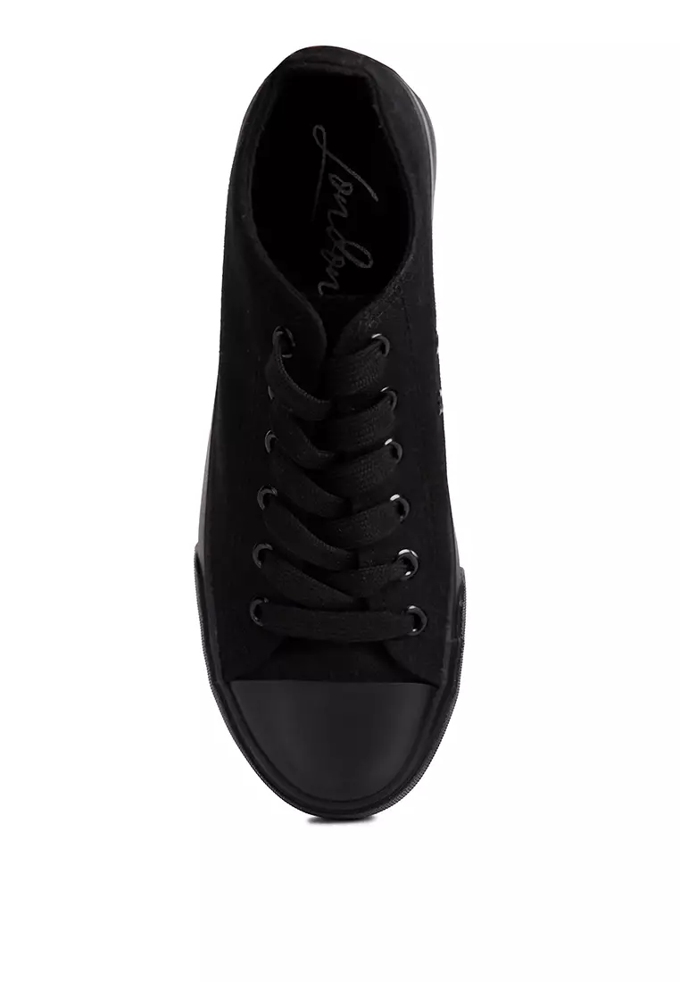 All black canvas sneakers top