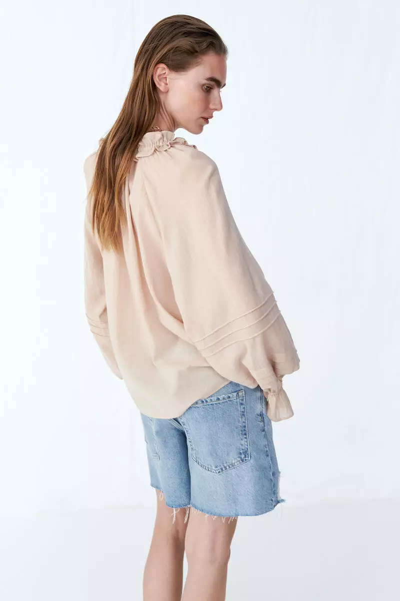 Raw-edge denim shorts