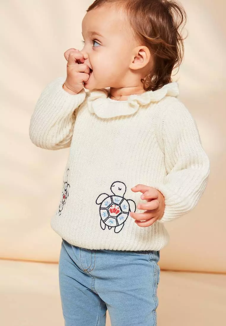 Ecru sweater with emboridery