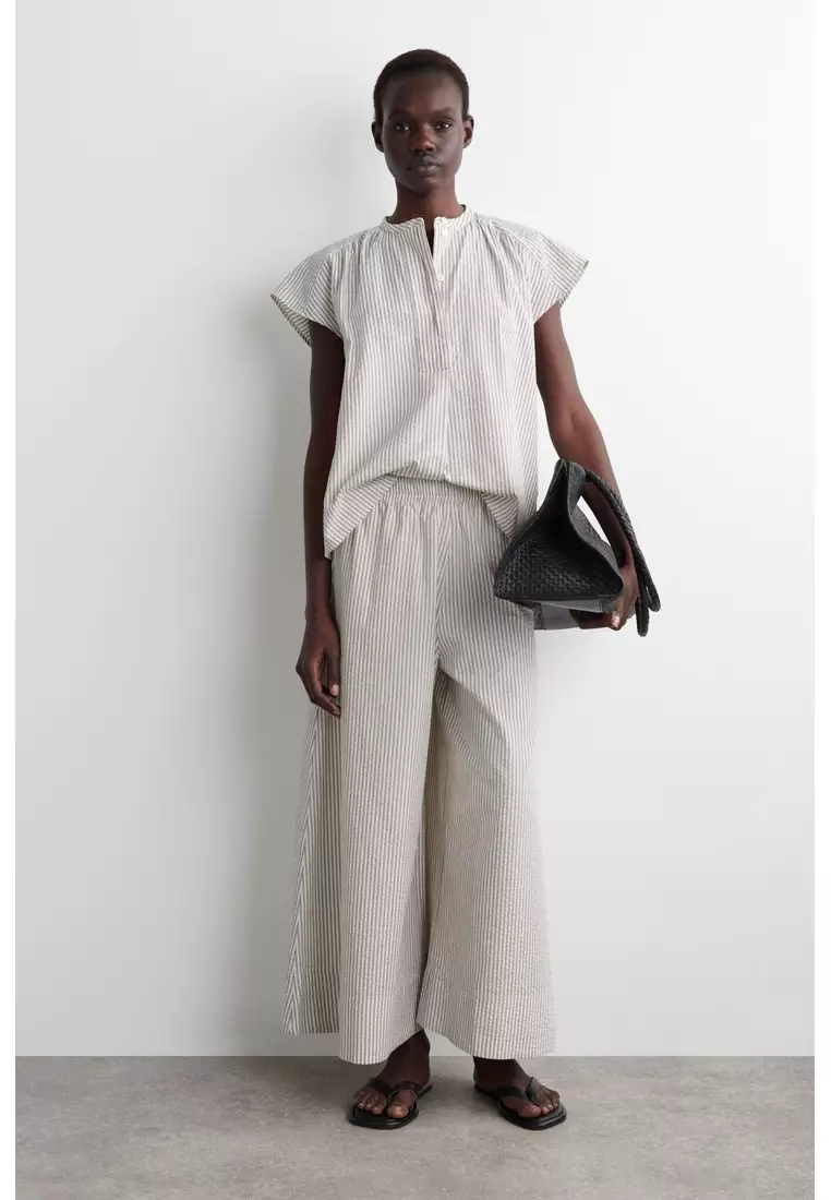 STRIPED SEERSUCKER FLARED-SLEEVE BLOUSE