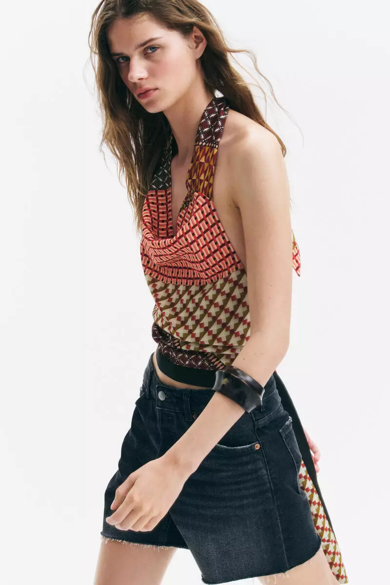 Raw-edge denim shorts