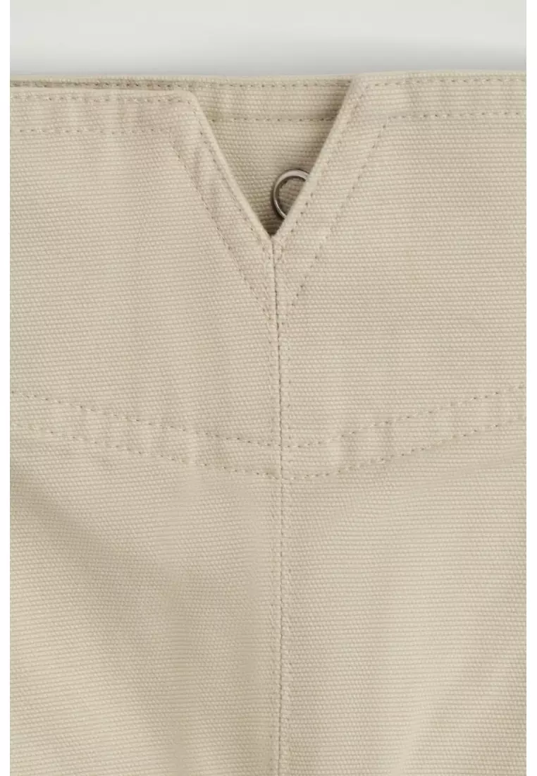PLEATED BUCKLE-DETAIL MINI SKIRT