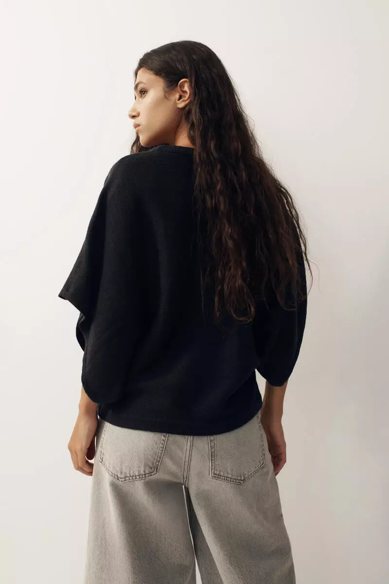 Batwing-sleeved knitted top