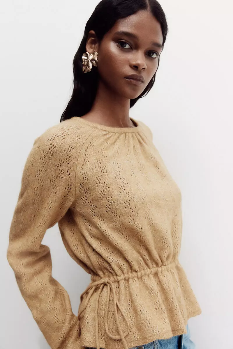 Pointelle-knit peplum top