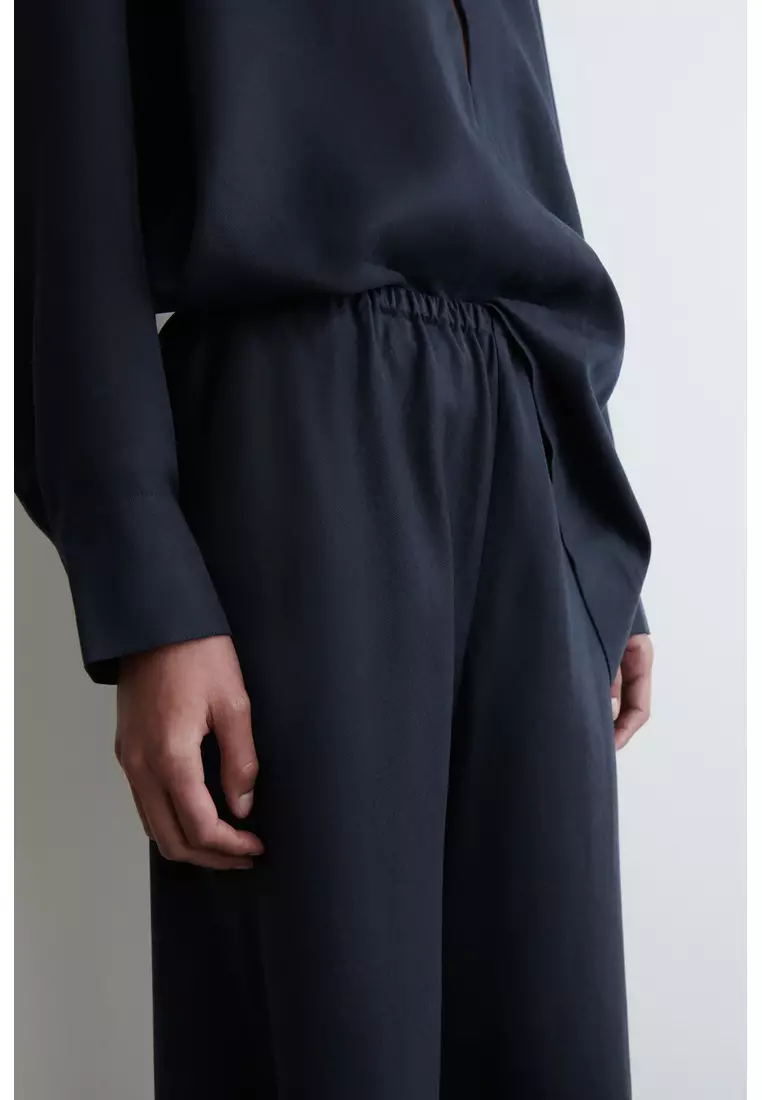 ELASTICATED WIDE-LEG TROUSERS