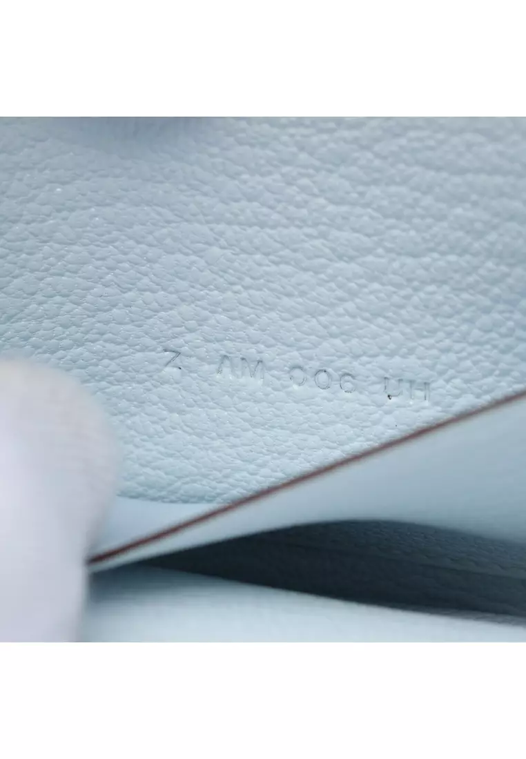 Pre-Loved Hermès Lawris Ruri slim Bi-fold wallet Chevre Light blue gold hardware Z stamp