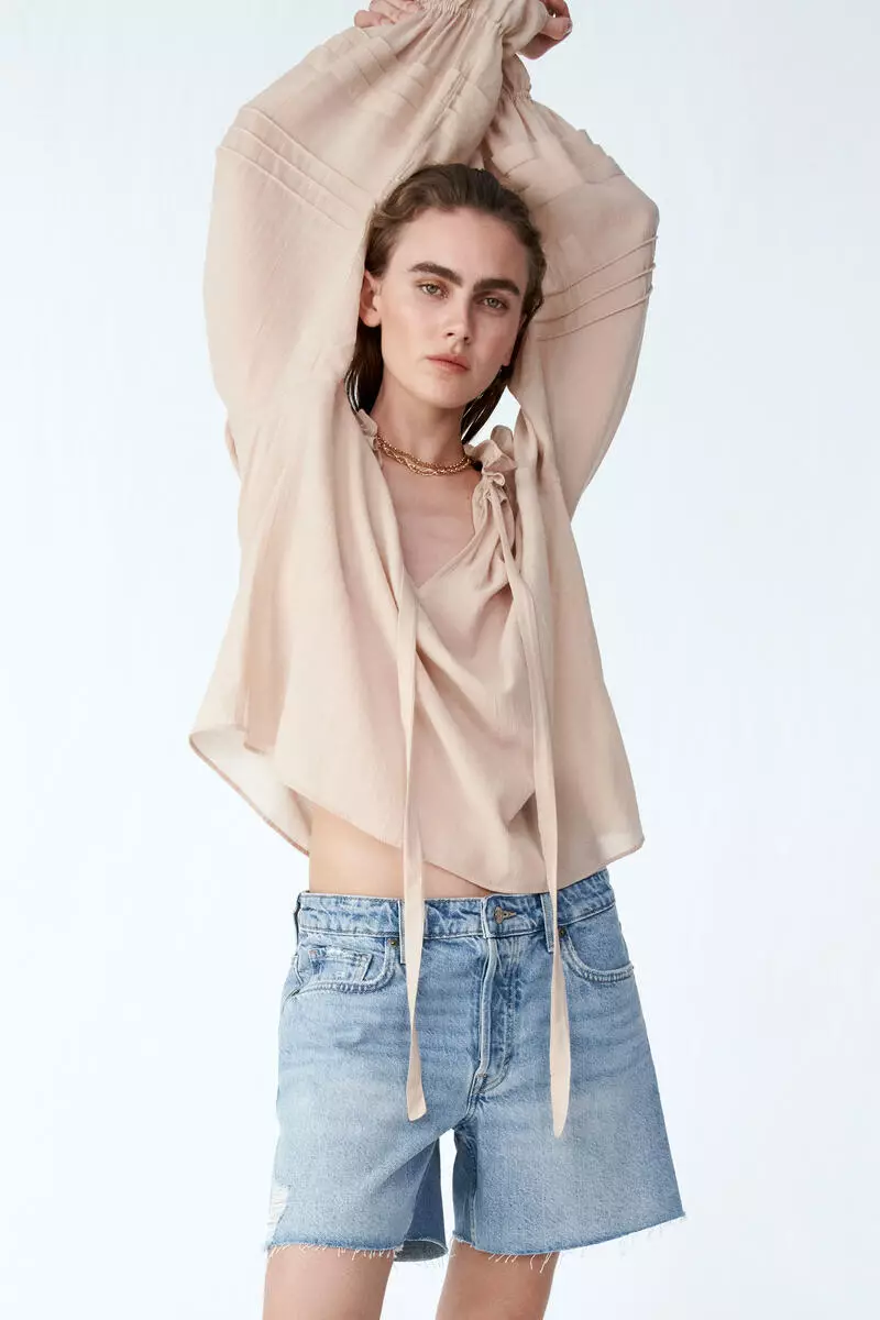 Raw-edge denim shorts