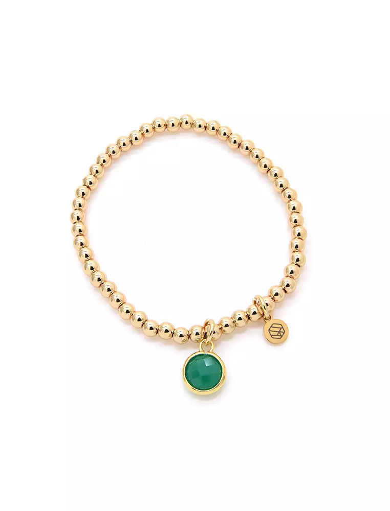 Gold bracelet with deals green stone