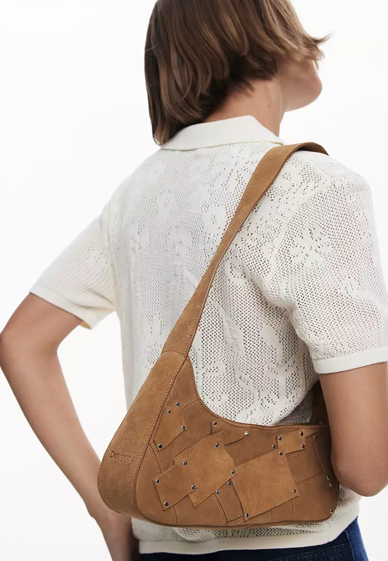 100% leather bag with small asymmetrical flap