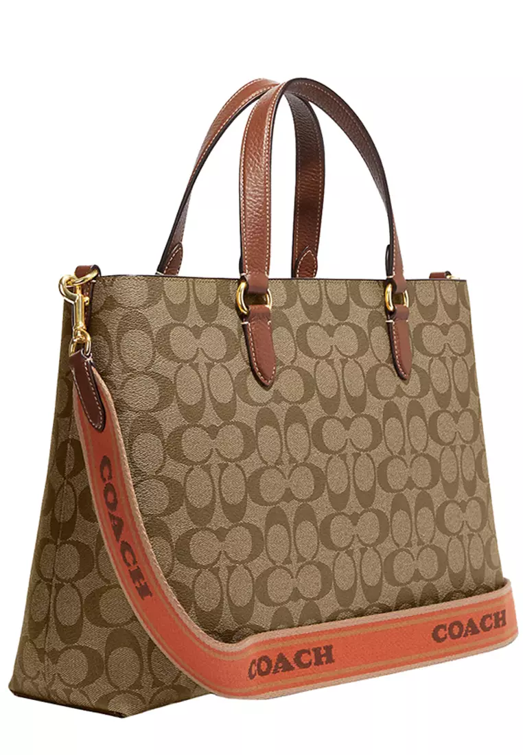 Buy Coach Coach Logan Carryall Bag In Signature Canvas in Khaki