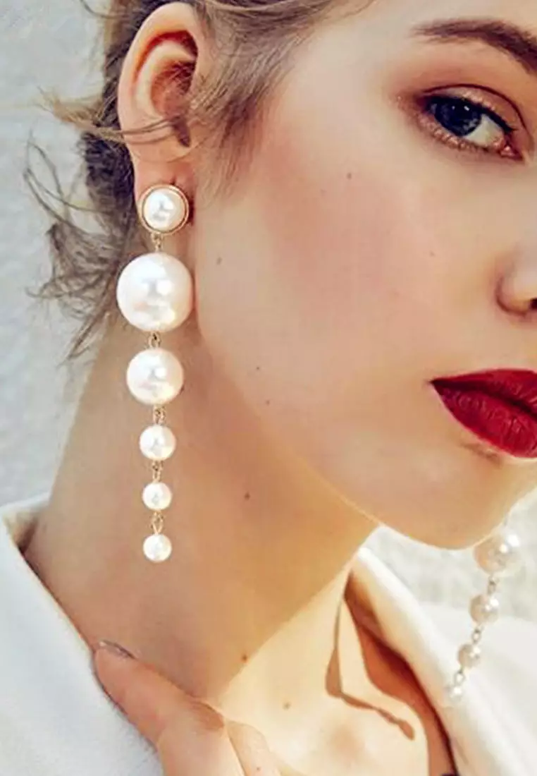 White beaded outlet drop earrings