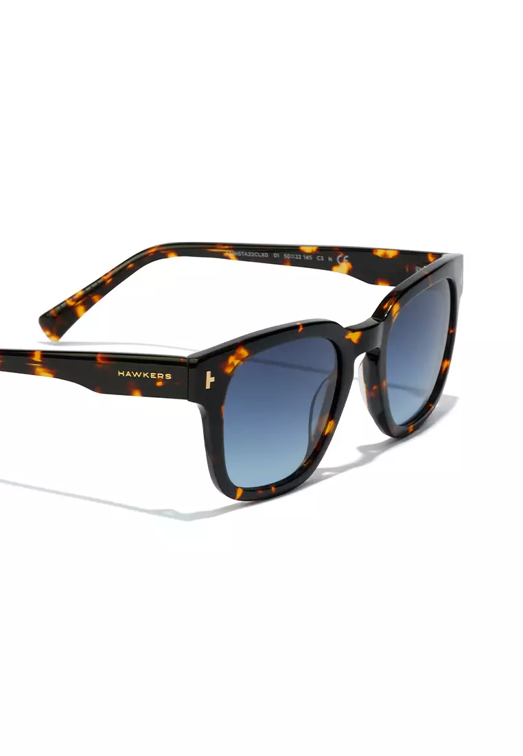 HAWKERS Carey Denim STACK Sunglasses for Men and Women, Unisex. UV400 Protection. Official Product designed in Spain