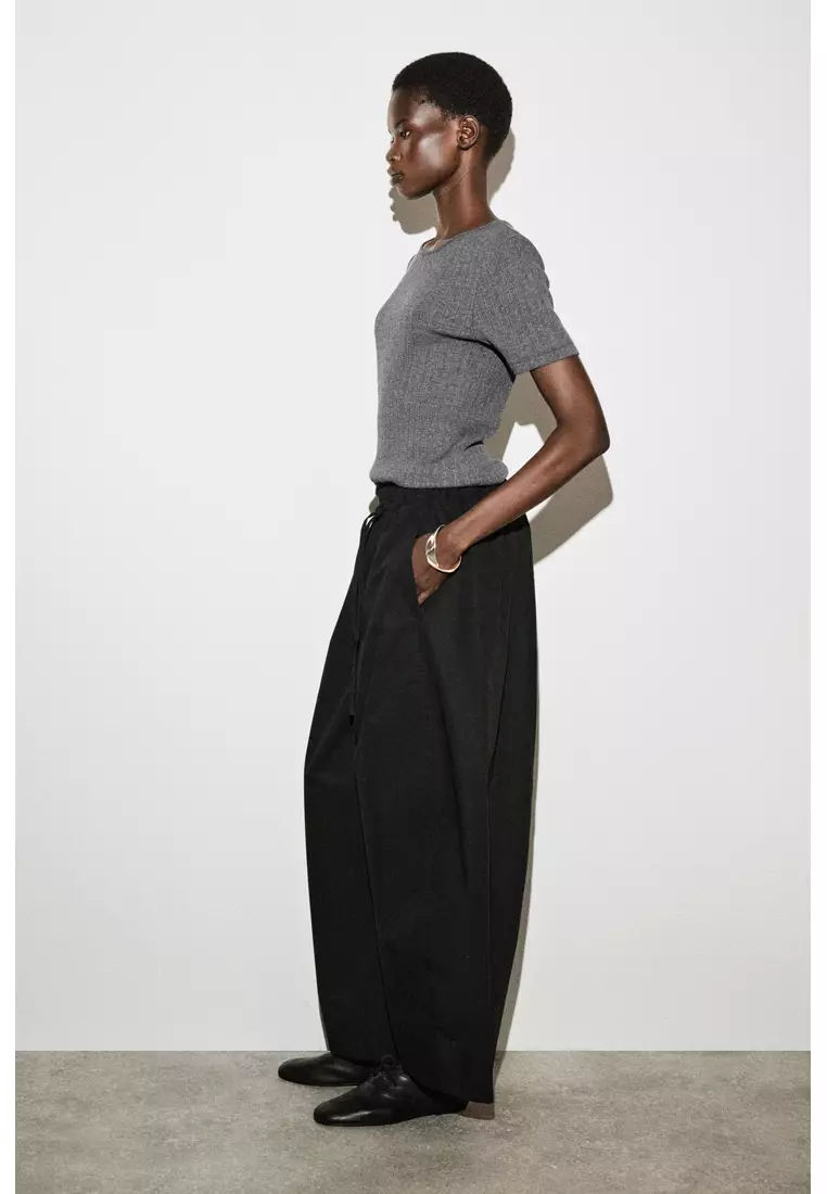 ELASTICATED BARREL-LEG TROUSERS