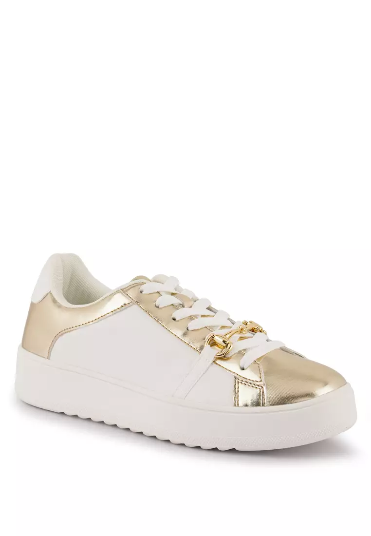 gold colored sneakers