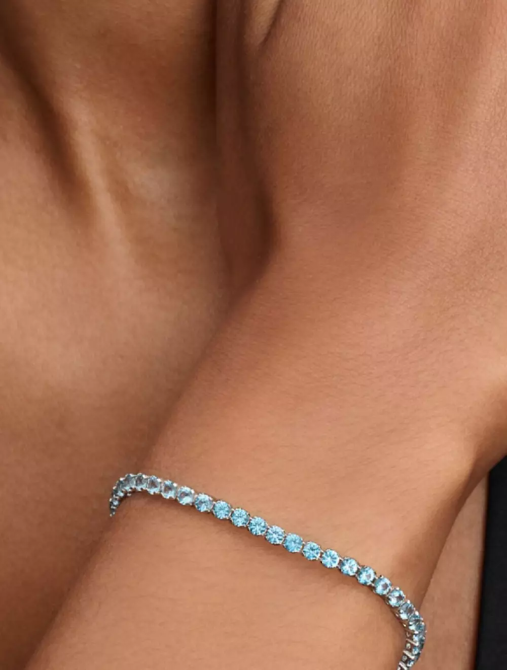 Sterling silver tennis bracelet with aquamarine blue crystal