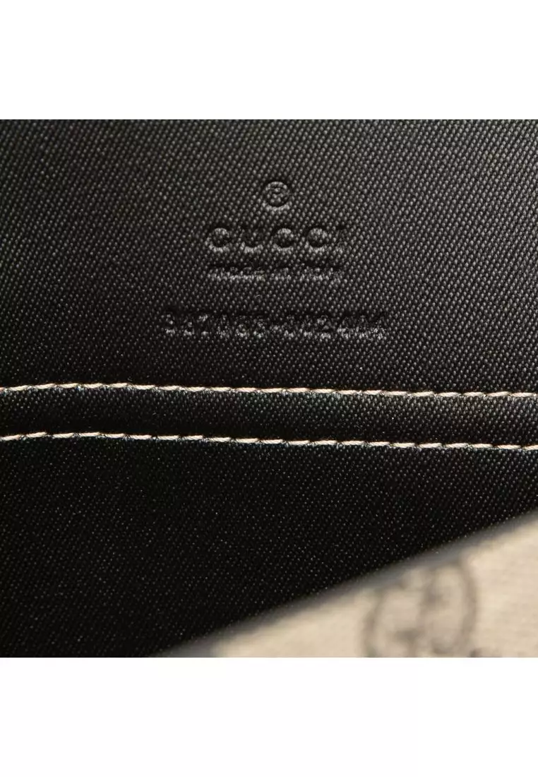 Pre-Loved Gucci Large Gg Supreme Clutch
