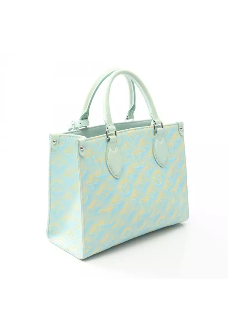 Pre-Loved Louis Vuitton On-the-Go PM Monogram Empreinte Handbag leather Light blue Light yellow 2WAY