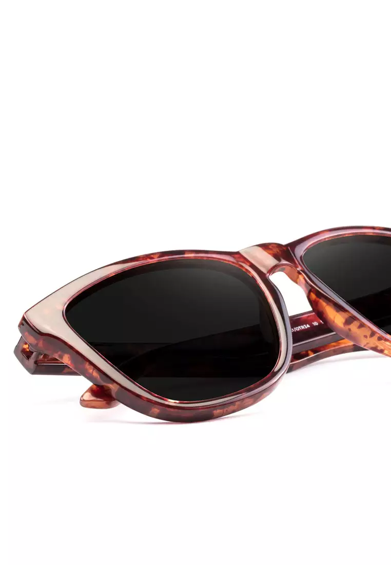 HAWKERS Dark One Sunglasses for Men and Women. UV400 Protection. Official Product Designed in Spain