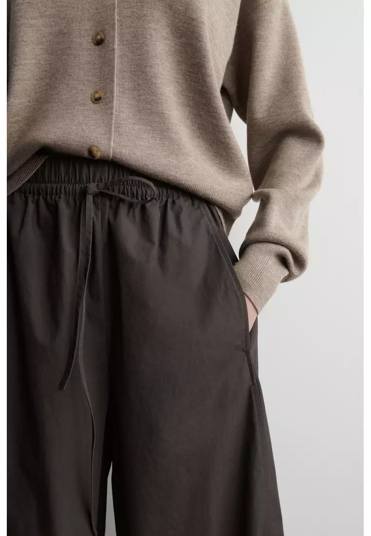 ELASTICATED BARREL-LEG TROUSERS