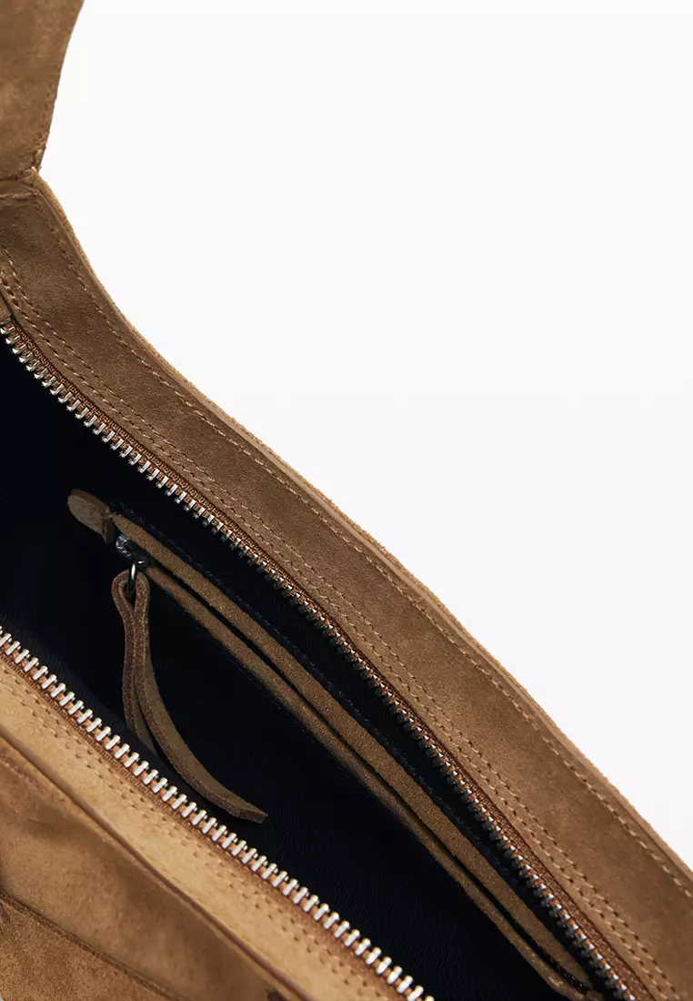 100% leather bag with small asymmetrical flap