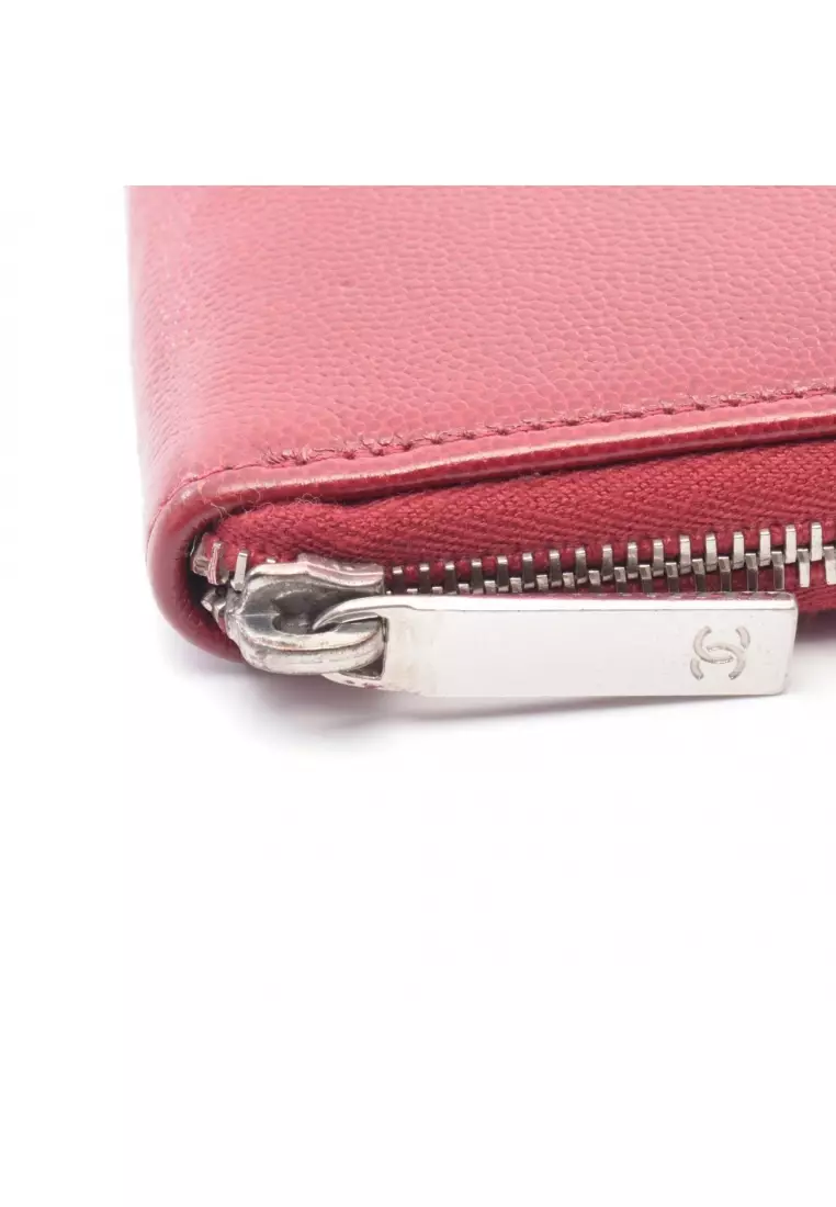 Pre-Loved Chanel round zipper long wallet Caviar skin Red silver hardware