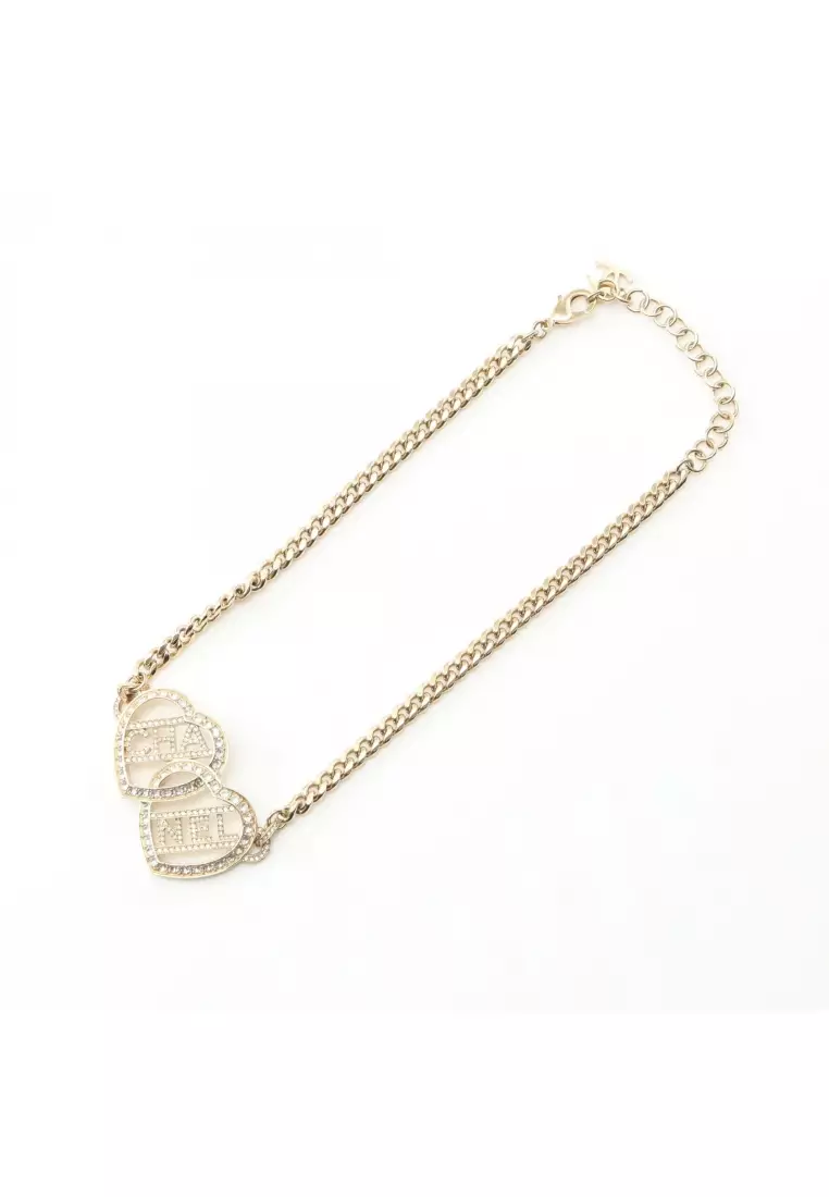 Pre-Loved Chanel choker heart logo GP Rhinestone gold clear F23B