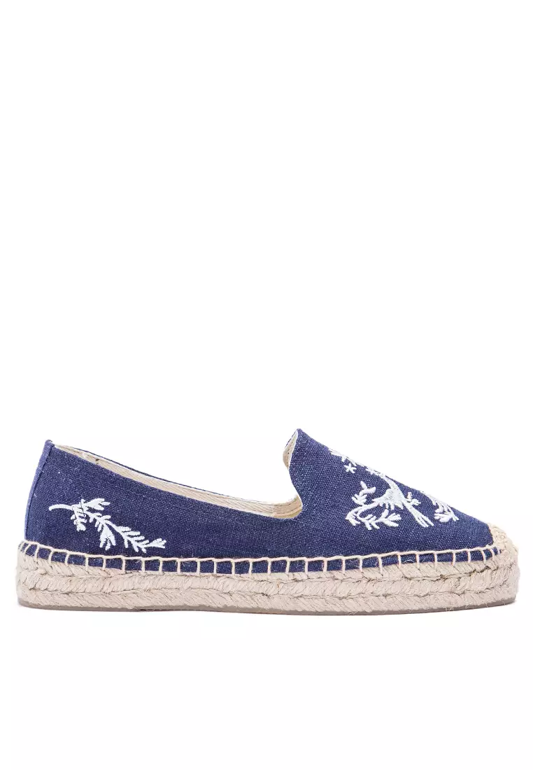 Puma suede platforms in white with embrodiery top