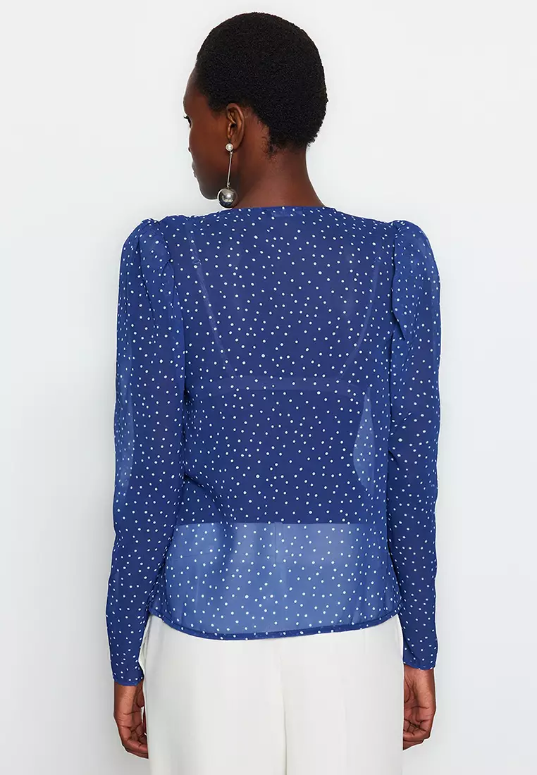 White blouse with 2024 blue polka dots