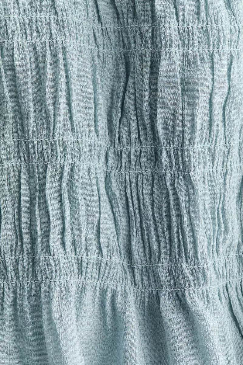 Smocked peplum top