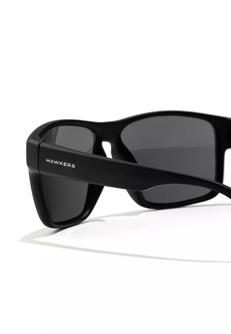 HAWKERS Black Dark FASTER Sunglasses for Men and Women. UV400 Protection. Official Product Designed in Spain