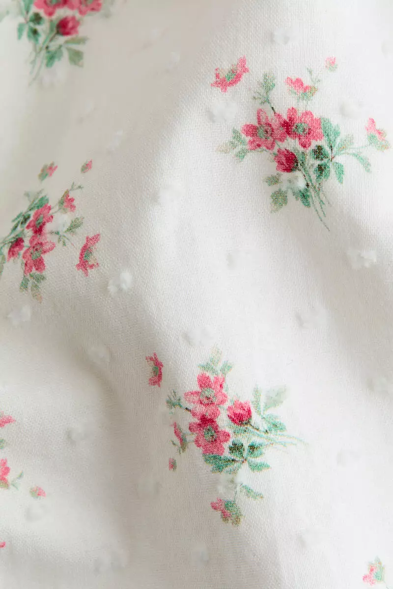 Frill-trimmed cotton romper suit