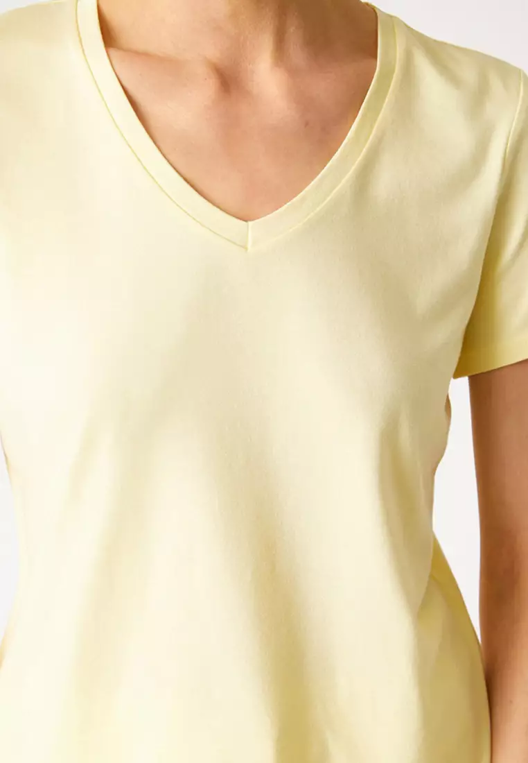 yellow v neck shirt