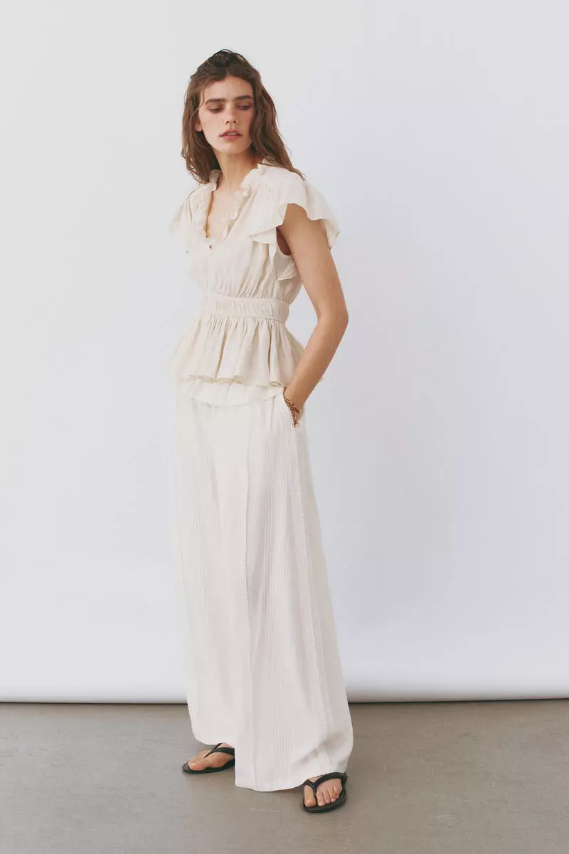 Flutter-sleeved peplum blouse