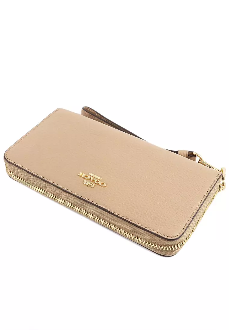 Coach beige wristlet 2025