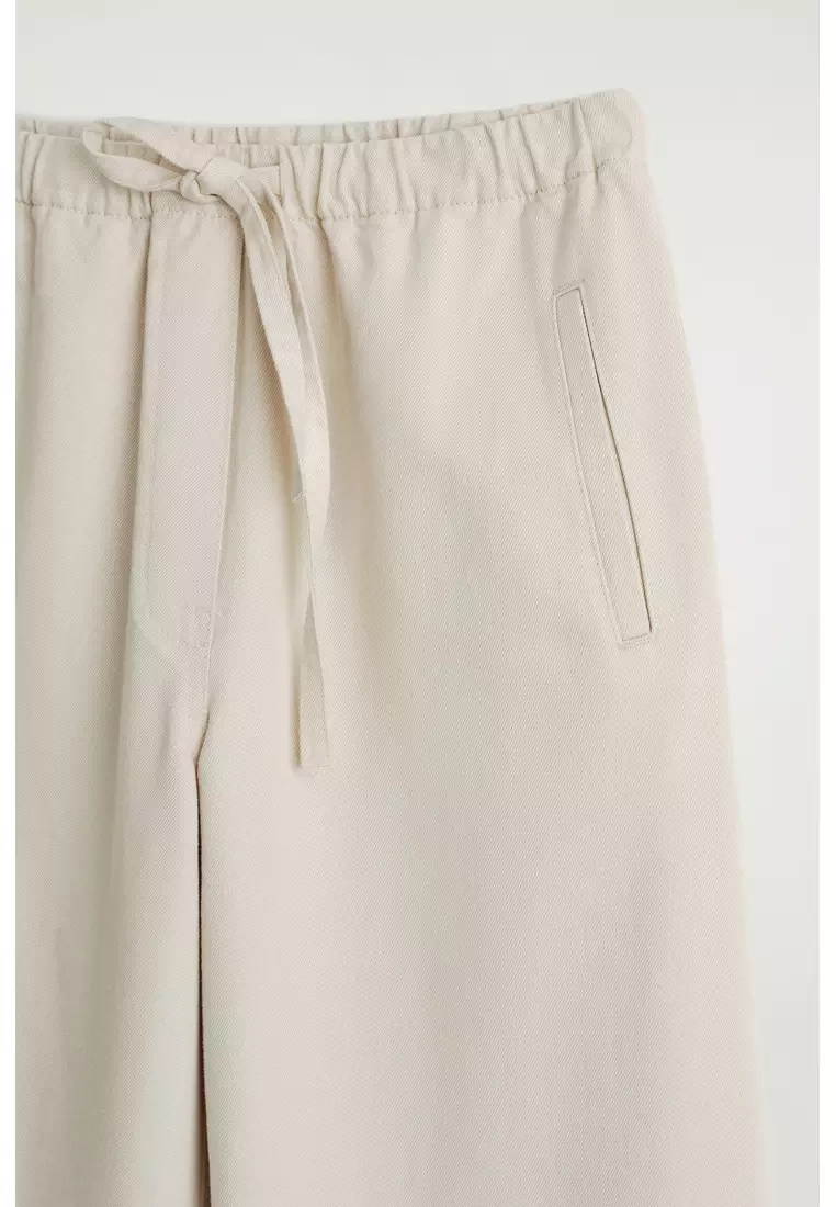 CROPPED DENIM WIDE-LEG TROUSERS