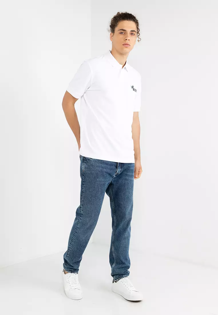 White polo shirt hot sale and blue jeans