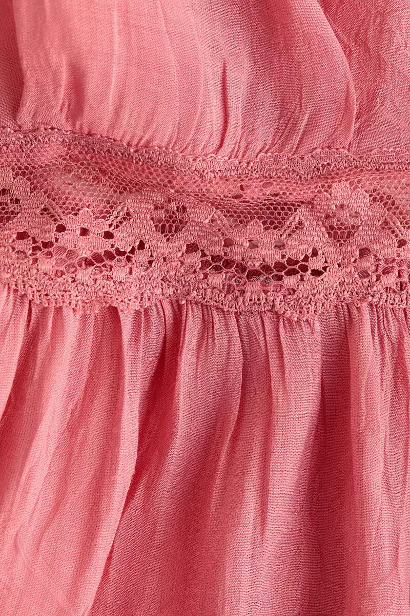 Lace-trimmed peplum top
