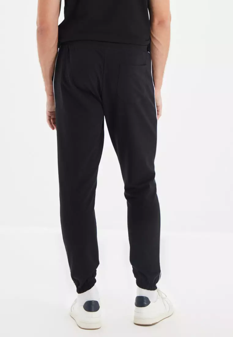 Ellesse flared joggers with side stripe taping, ASOS