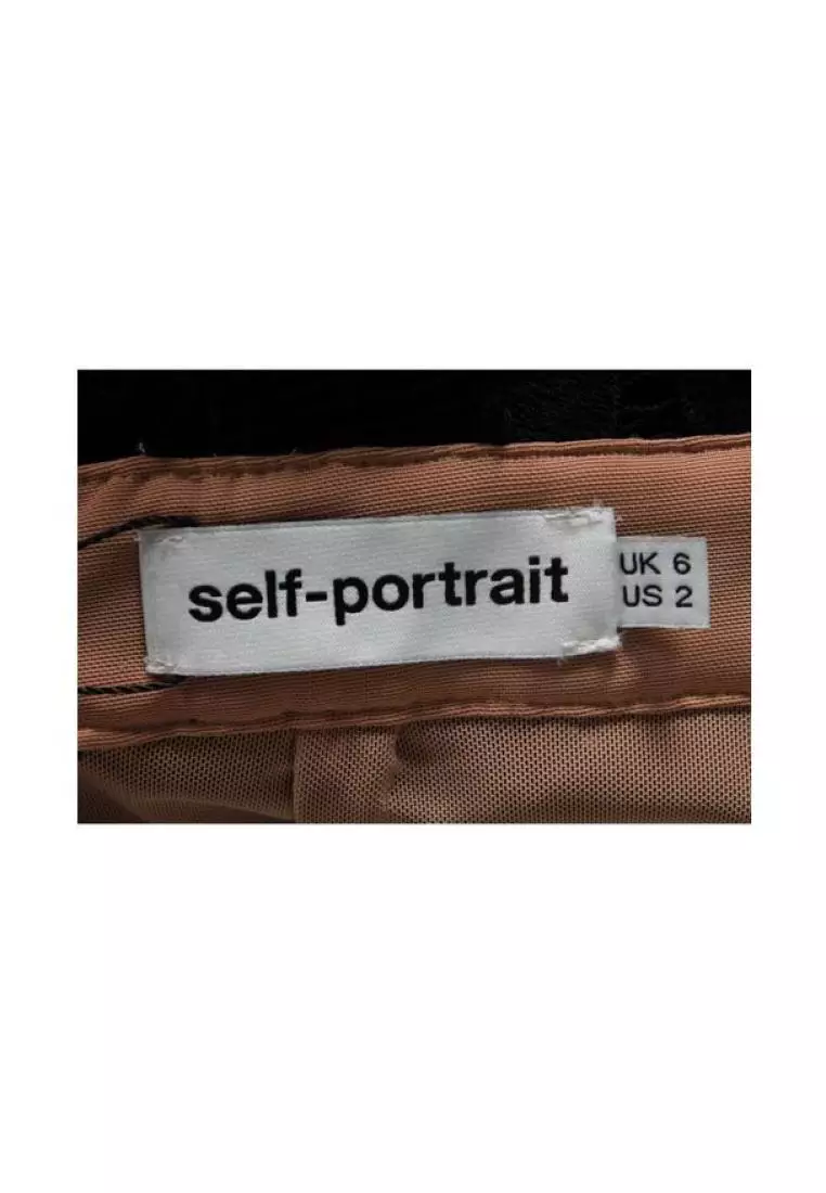 Self portrait label store