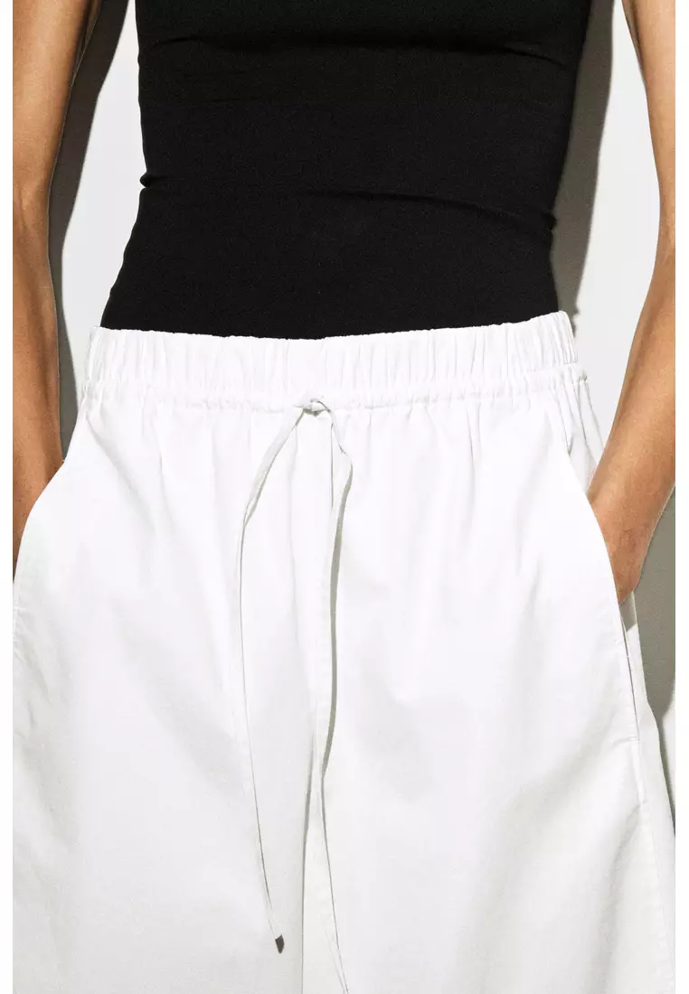 ELASTICATED BARREL-LEG TROUSERS