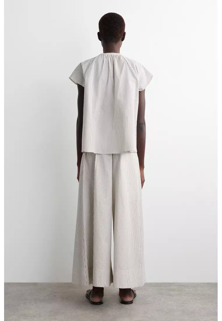 STRIPED SEERSUCKER FLARED-SLEEVE BLOUSE