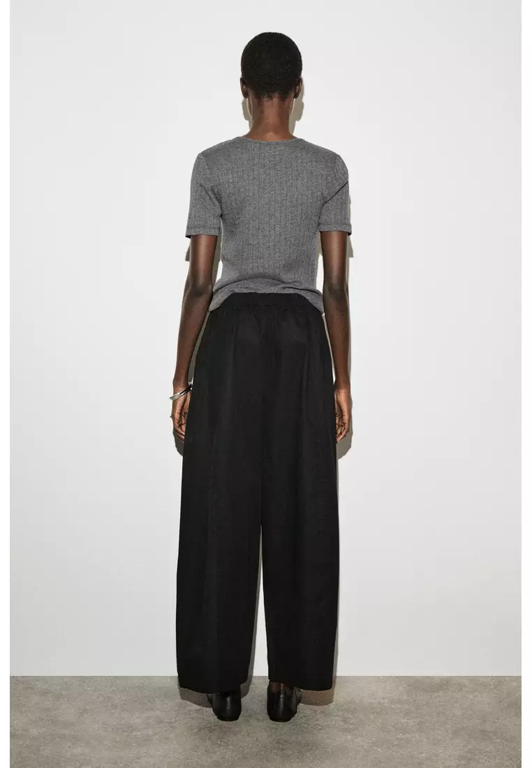 ELASTICATED BARREL-LEG TROUSERS